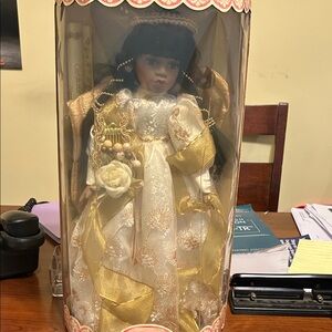 Elegant Porcelain Doll with Gold and White Dress